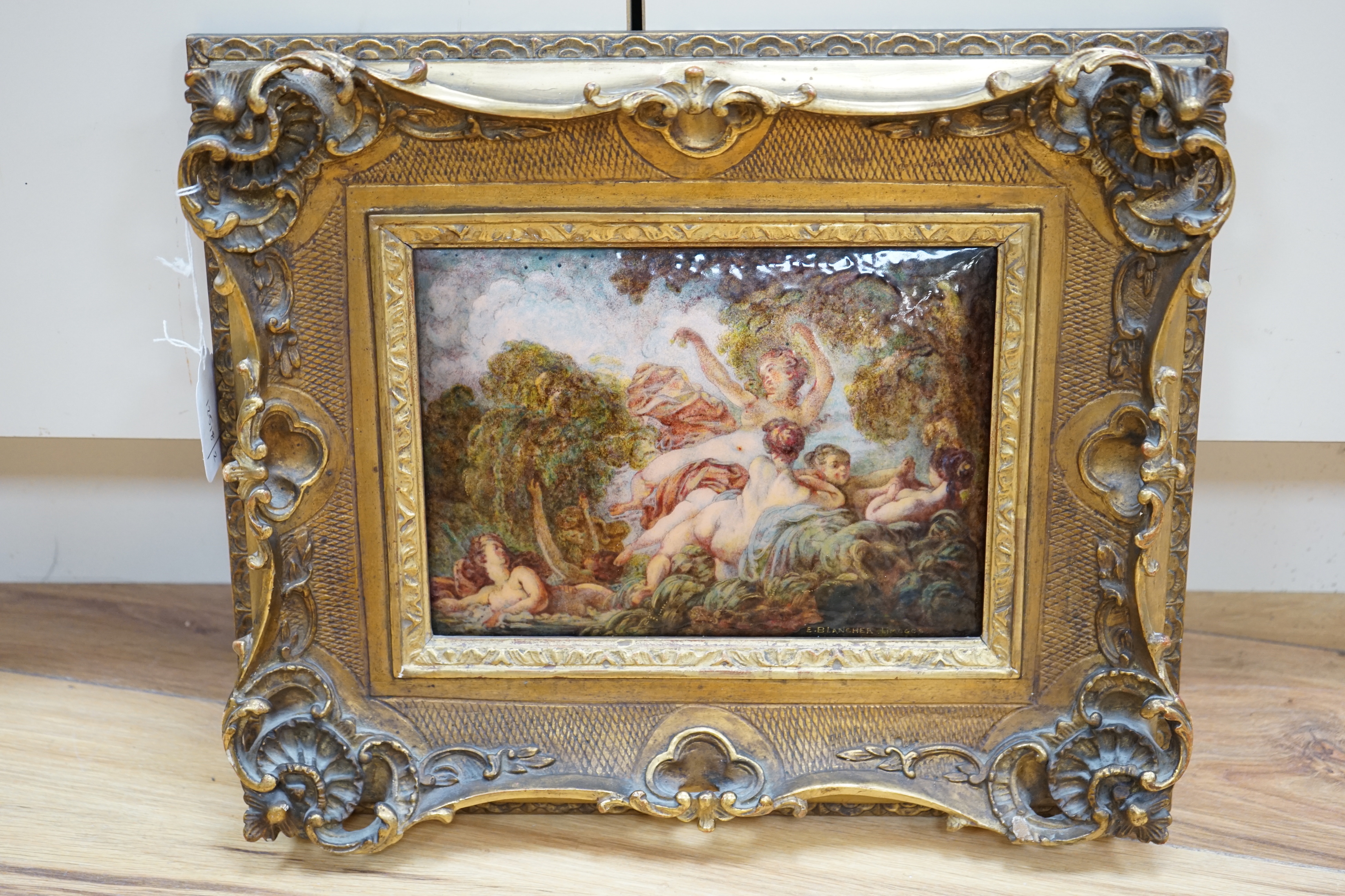 Ernest Blancher (1855-1935) After Jean-Honoré Fragonard (French, 1732-1806) Limoges convex plaque enamelled with nude females amongst foliage, signed, French 1923 Exhibition label verso, 17 x 23cm, ornate gilt framed